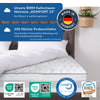 BMM Kaltschaum-Matratze ‚KOMFORT 23‘ auf einem Bett mit weißer Bettdecke. Text: ‚Unsere BMM Kaltschaum-Matratze KOMFORT 23 – zertifiziert & vielfach getestet‘ sowie ‚100 Nächte Probeschlafen – Unzufrieden? Kostenfreie Abholung und volle Kaufpreiserstattung‘. Unten sind Zertifikate von OEKO-TEX®, CertiPUR™ und LGA Qualitätssiegel abgebildet. Oben rechts ein ‚Made in Germany‘-Logo
